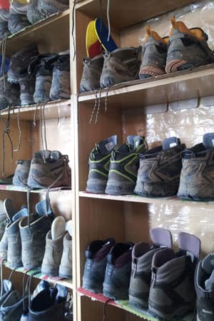 Boots on shelves along the Camino de Santiago
